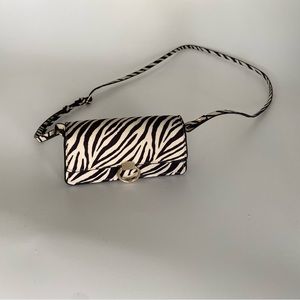 H&M crossbody purse in black and white animal print.